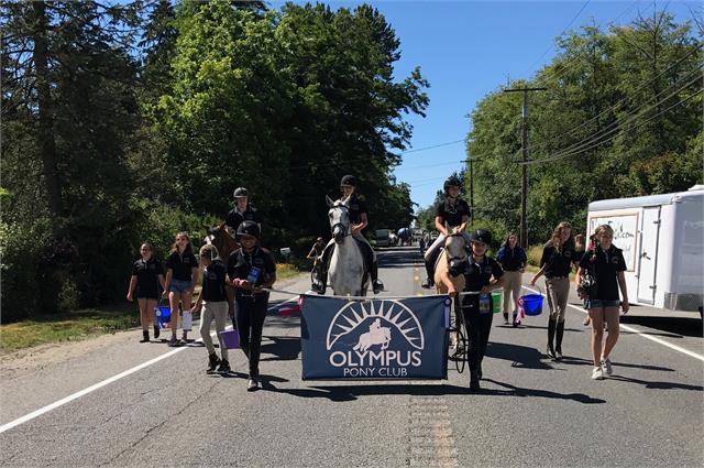 Olympus Pony Club marching during the Vashon Strawberry Festival 